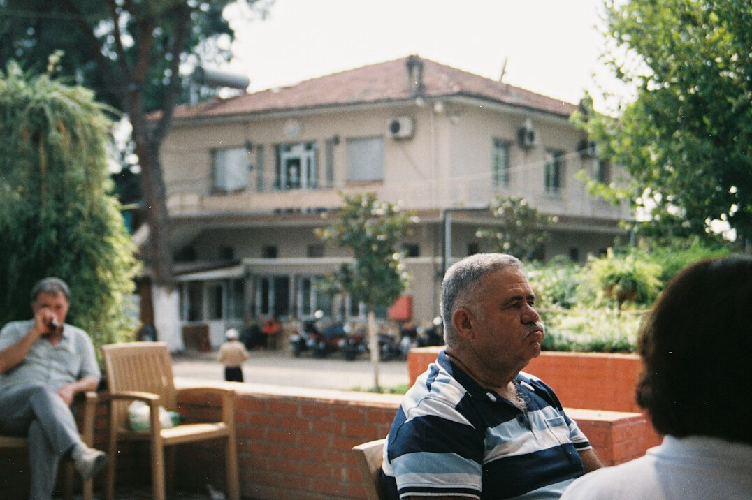 elderly neighbors chatting outdoors